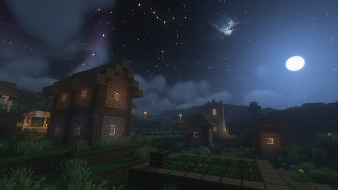 Uma vila de Minecraft durante a noite.