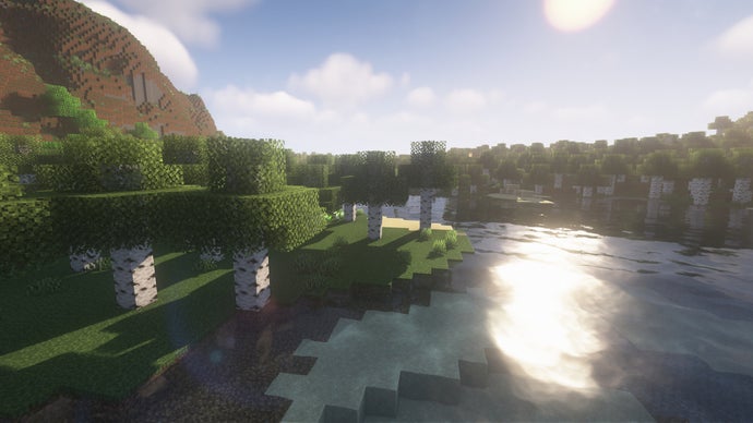 Uma floresta de bétulas ao lado de um rio em Minecraft.