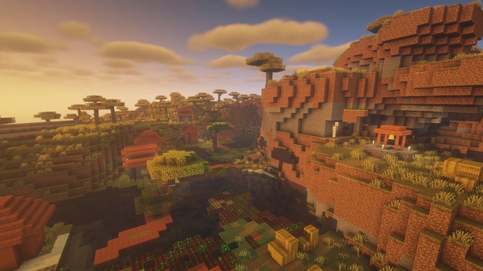 Uma vila de Minecraft em uma encosta.