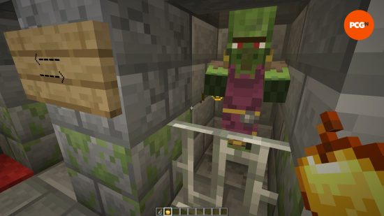 Um aldeão zumbi preso no porão de um iglu em uma das melhores seeds do Minecraft na versão 1.20.